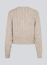 Knitted cable knit cardigan with pearl buttons. Pammiemd cardigan has a round neckline and ribbed hem.