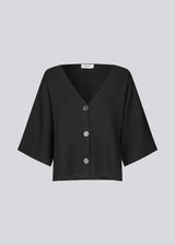 Knitted cardigan with short sleeves in EcoVero viscose. Paris SS cardigan has a v-neck and button closure in front.&nbsp;