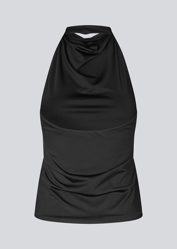 Fitted halterneck top without sleeves. Parissamd top has draped details at the front and an open back.