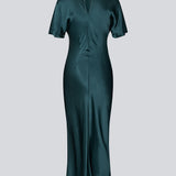 Green long satin dress with draping detail. Parveenmd dress has short sleeves and an invisible zipper in the back. The model is 175 cm and wears a size s/36.