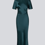 Green long satin dress with draping detail. Parveenmd dress has short sleeves and an invisible zipper in the back. The model is 175 cm and wears a size s/36.