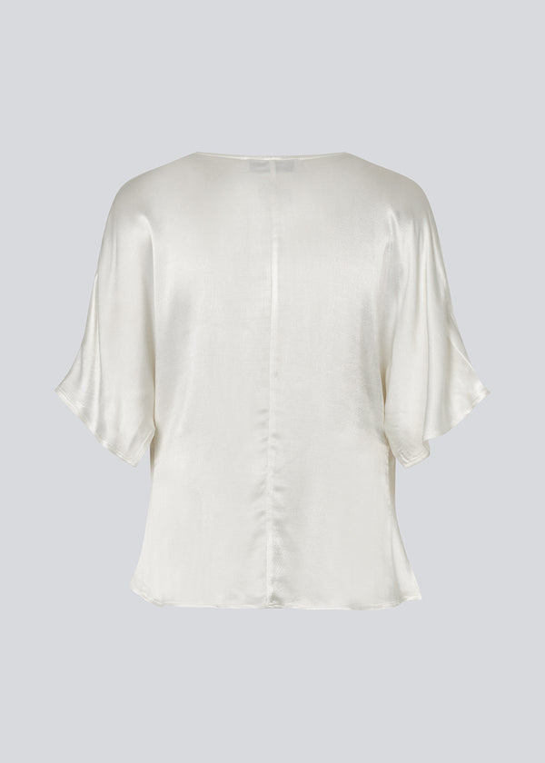 White satin top with a waterfall detail. Parveenmd top is fitted and has short sleeves.&nbsp;