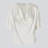 White satin top with a waterfall detail. Parveenmd top is fitted and has short sleeves.&nbsp;