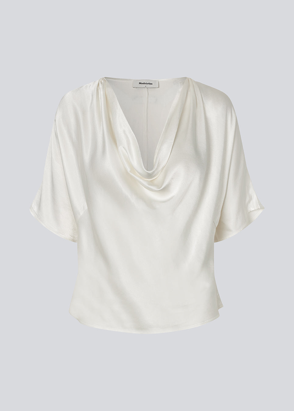 White satin top with a waterfall detail. Parveenmd top is fitted and has short sleeves.&nbsp;