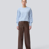 Light blue soft knit with loose sleeves. Patrickmd O-neck has a round neckline and ribbed hem. The model is 175 cm and wears a size s/36.