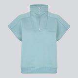 Short-sleeved sweatshirt in blue with a sporty twist. The PaulaMD SS T-neck features a high collar with a zipper, allowing you to choose between a cool high-neck look or a more open, relaxed style. Details such as the chest logo and ribbed hem add a clean, modern touch.