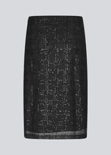 Black midi skirt in a transparent material with sequins. Pearleenmd skirt has lining and an invisible side zipper.&nbsp;