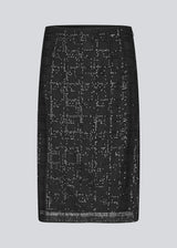 Black midi skirt in a transparent material with sequins. Pearleenmd skirt has lining and an invisible side zipper.&nbsp;