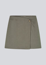 Skirt with an asymmetric look. Pedromd skirt is short and has a front button closure.&nbsp;