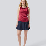 Short skirt with box pleats and a medium high waist. Peggiemd skirt has a hidden zipper in the side. The model is 175 cm and wears a size s/36.