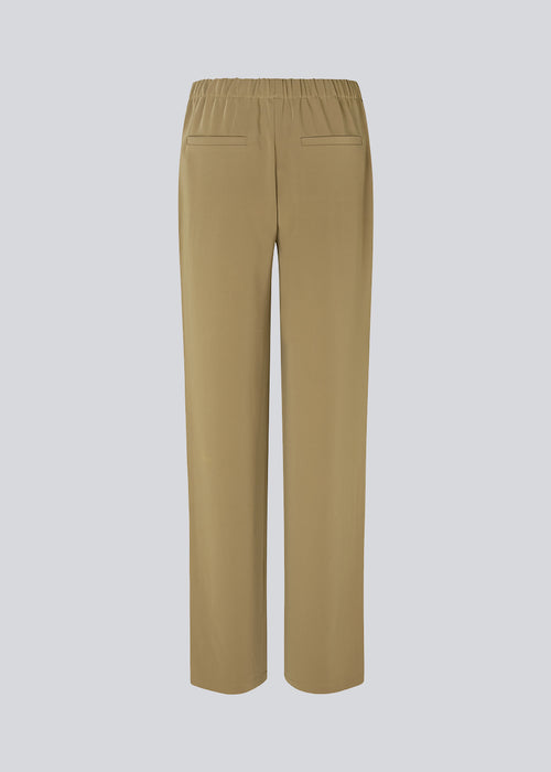Pants in a simple design with wide legs. Perry pants have pockets at the side seam and an elasticated waistline for a comfortable fit. 