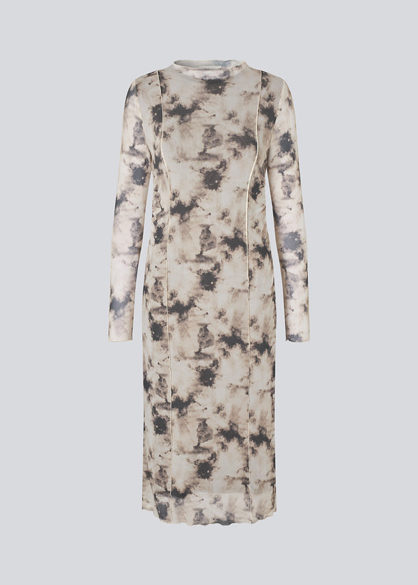 Maxi dress with long-sleeves in a transparent material. &nbsp;Petrinamd print dress is fitted and has a gathering detail at the side.&nbsp;