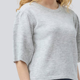 Soft knit with short puff sleeves. Petronellamd SS o-neck has a round neckline and ribbed trim. The model is 175 cm and wears a size S/36.