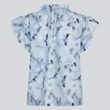 Sleeveless top with ruffled details. Phillipsmd print top has a v-neck with a button closure and ruffles at the neck and sleeves.