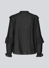 Black Shirt with ruffle details and a front opening. Phungmd shirt has a loose fit and flowy sleeves.