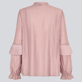 Shirt in the color "Fragrant Lilac" with ruffle details and a front opening. Phungmd shirt has a loose fit and flowy sleeves.