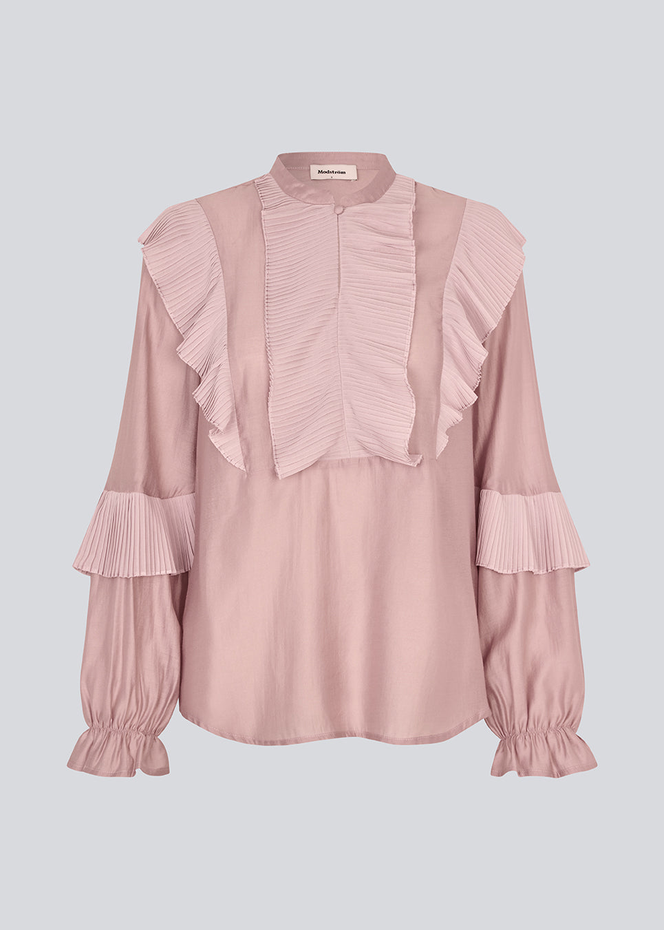 Shirt in the color "Fragrant Lilac" with ruffle details and a front opening. Phungmd shirt has a loose fit and flowy sleeves.