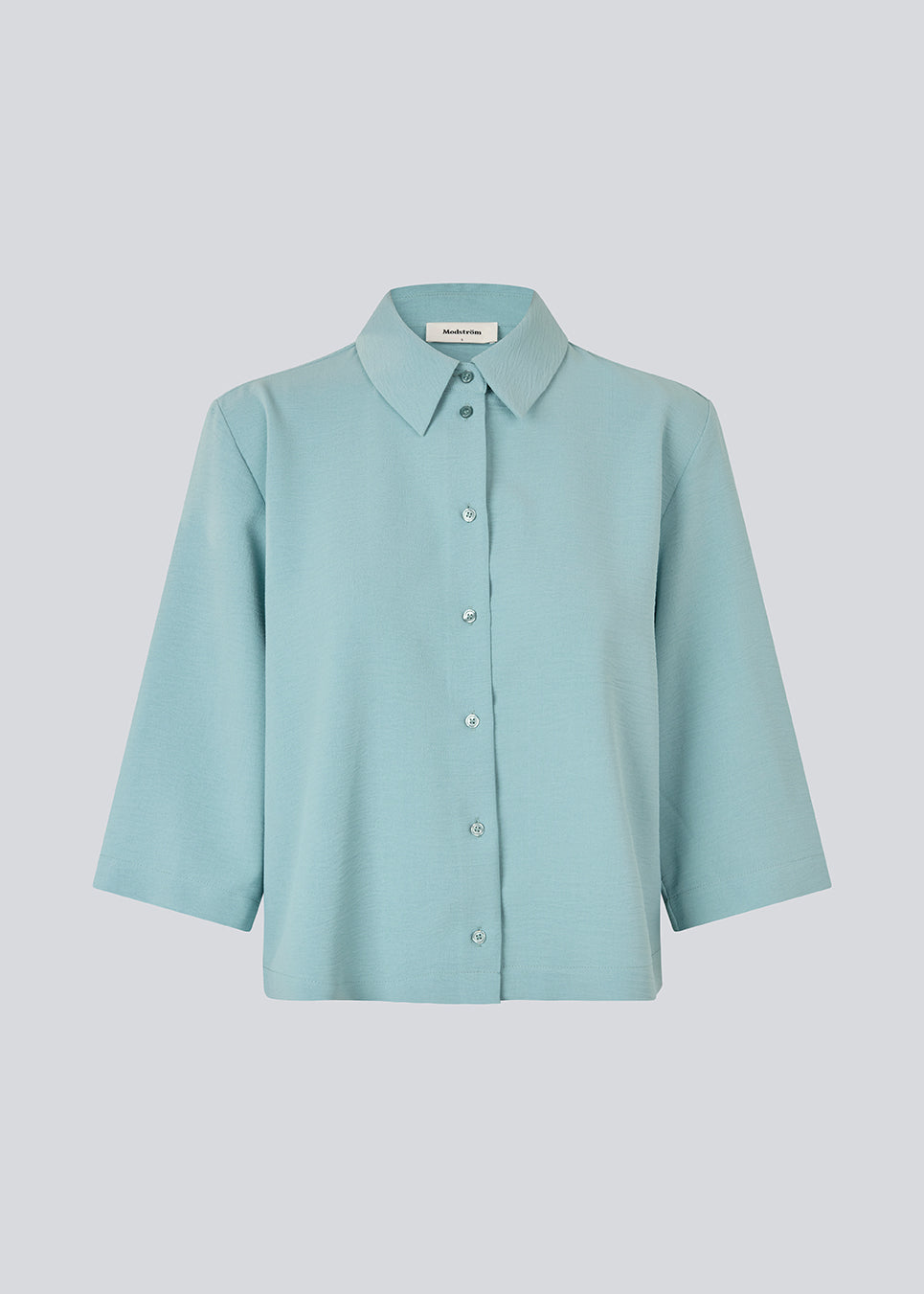 Shirt with 3/4 sleeves in blue in 100% recycled polyester. Popelmd shirt has a loose fit and button closure in front.