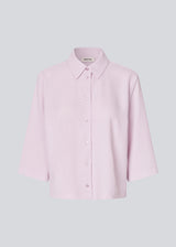 Shirt with 3/4 sleeves in 100% recycled polyester. Popelmd shirt has a loose fit and button closure in front.