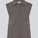 Grey loose vest with a hidden front button closure. Primrosemd vest has a shirt collar and two front pockets.&nbsp;
