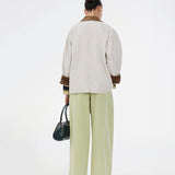 Wide-leg jeans in green cotton denim. Princessmd pants have a high waist with elastic and front and back pockets. The model is 175 cm and wears a size S/36.

