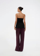 Black corset top with button details. The Ridermd top features a smocked back and invisible zipper – a flattering and timeless piece.