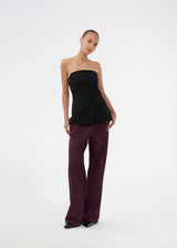 Black corset top with button details. The Ridermd top features a smocked back and invisible zipper – a flattering and timeless piece.