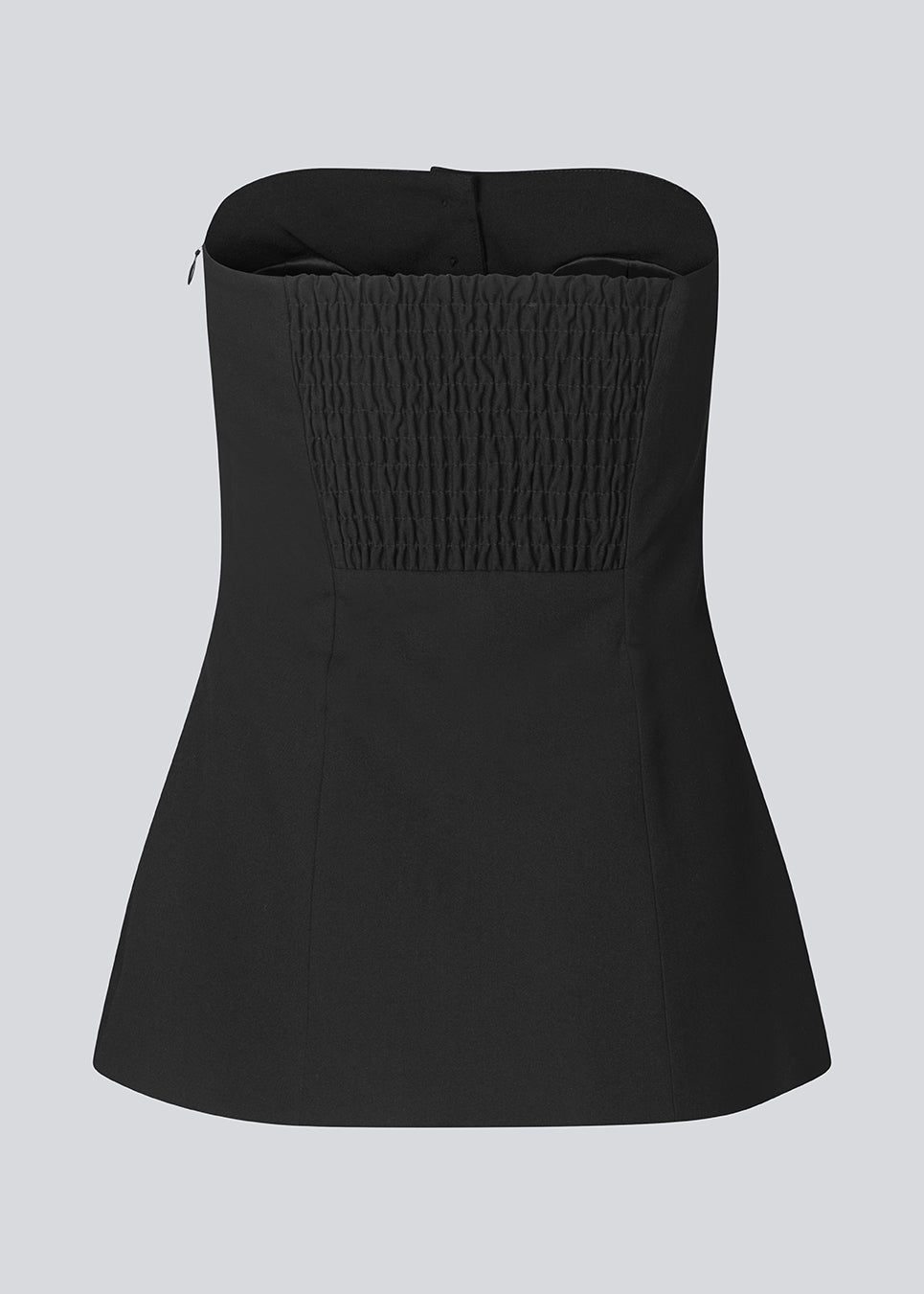 Black corset top with button details. The Ridermd top features a smocked back and invisible zipper – a flattering and timeless piece.