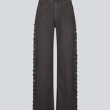 Light black/grey Jeans with wide legs. The Riyamd pants feature a high waist and decorative details along the legs – giving them a cool and edgy look.
