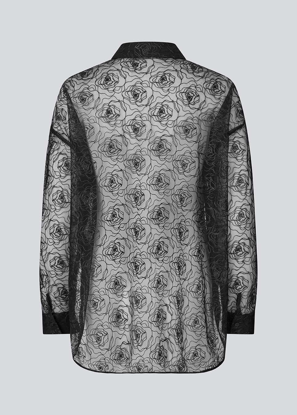 Oversized shirt in sheer material. The Roccomd long shirt features a classic collar and button closure with beautifully stitched rose embroidery – feminine and stylish with a modern silhouette.