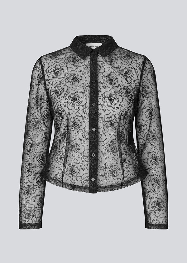 Black fitted shirt in sheer material. The Roccomd shirt features a classic collar and button closure with beautifully stitched rose embroidery – both feminine and stylish.