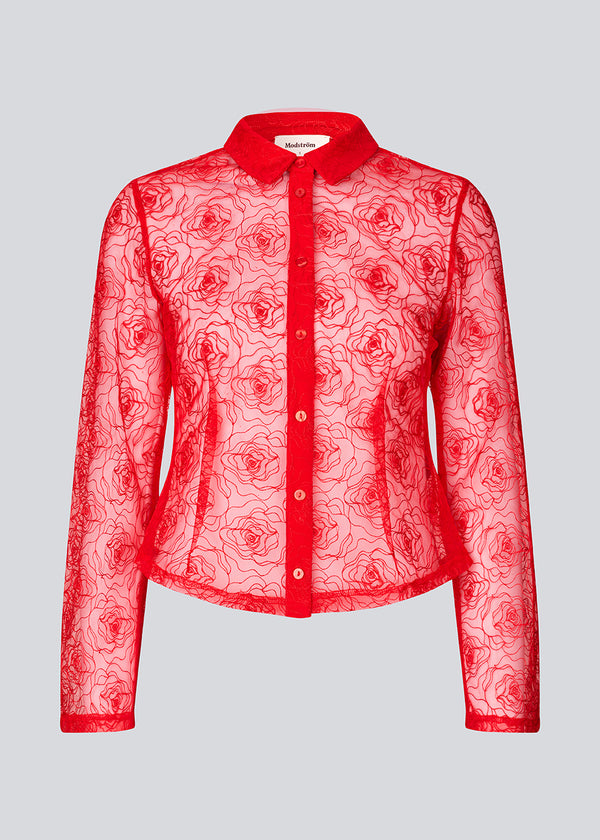 Red fitted shirt in sheer material. The Roccomd shirt features a classic collar and button closure with beautifully stitched rose embroidery – both feminine and stylish.