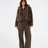 Wool trousers with wide legs. The Rockymd pants have a high waist, front pleats, and side pockets – a structured, classic pants with a timeless feel.