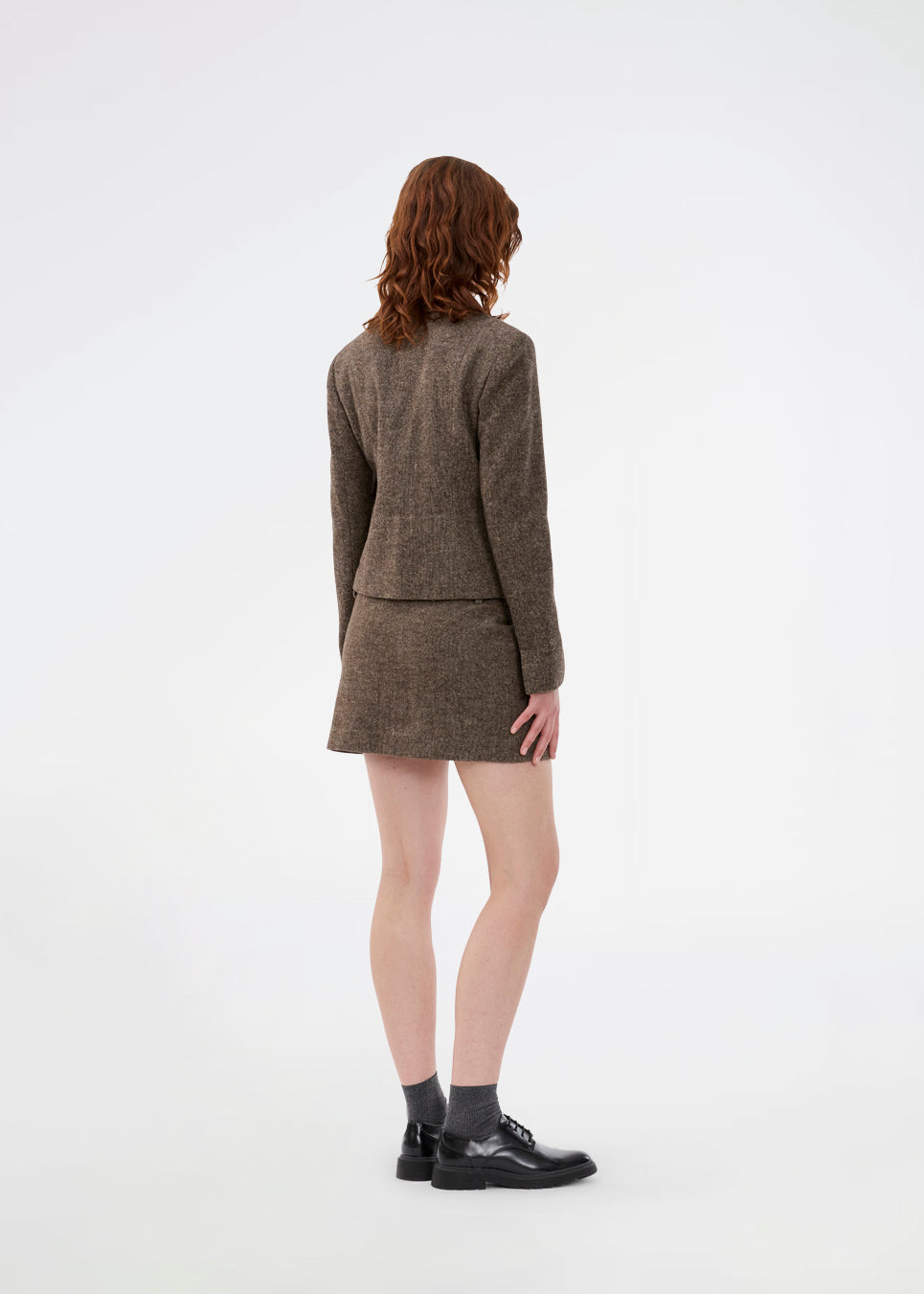 Mini skirt in wool. The Rockymd skirt features a wide belt with a decorative buckle – offering a cool and edgy look.
