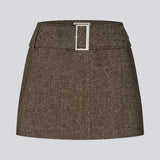 Mini skirt in wool. The Rockymd skirt features a wide belt with a decorative buckle – offering a cool and edgy look.