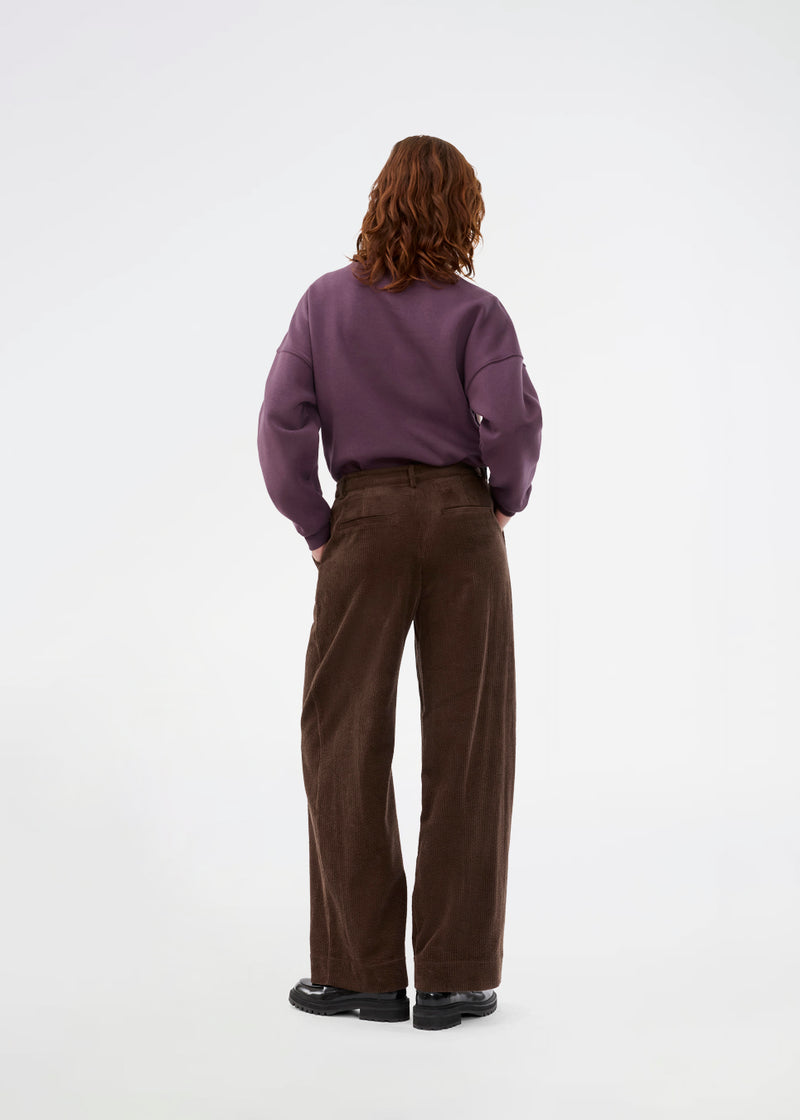 Suit trousers with pleats in corduroy. Pablomd wide pants has long wide legs with sidepockets.