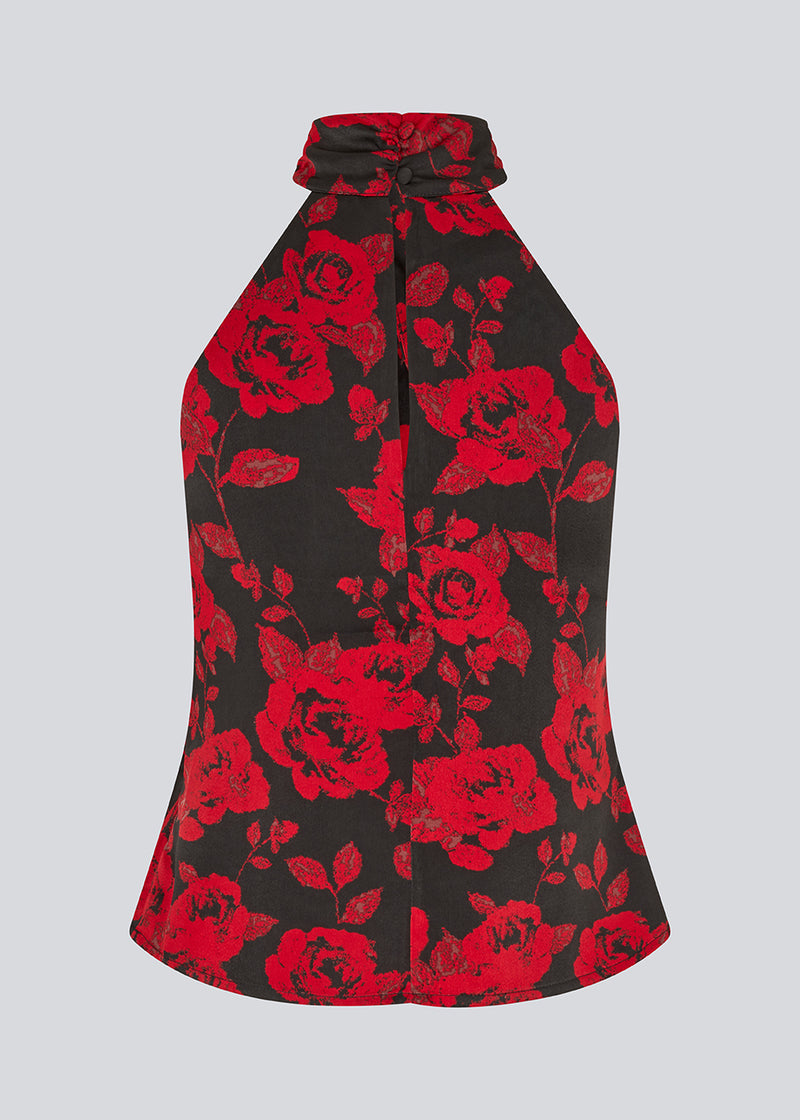 Halterneck top in a beautiful rose print. The Ruthiemd print top features an open back and is made from recycled polyester – graceful and classic.