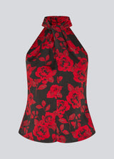 Halterneck top in a beautiful rose print. The Ruthiemd print top features an open back and is made from recycled polyester – graceful and classic.