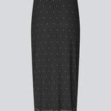 Form-fitting mesh skirt with polka dots and petticoat. Made from 92% recycled polyester, the Samalamd Print Skirt combines stretchability with comfort.
