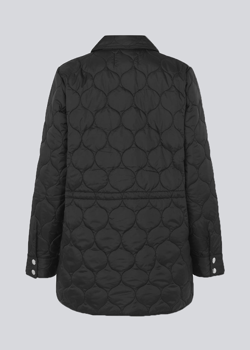 Padded jacket in a quilted, recycled nylon with press-studs down the front, two large flap pockets in a contrasting material, and a rounded hem. SamuelMD jacket has a roomy fit.