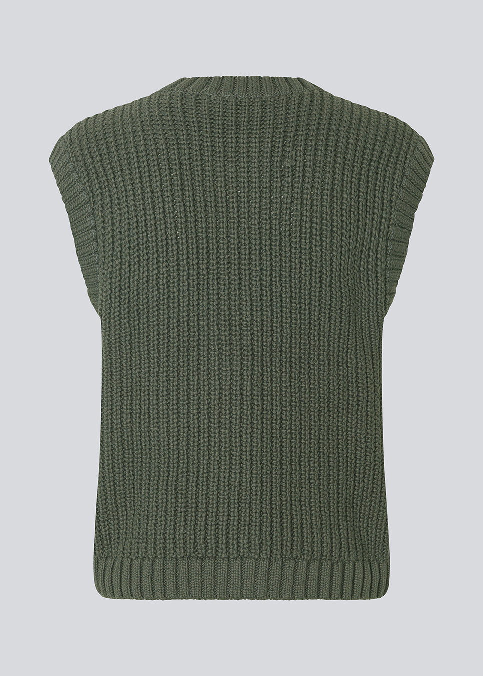 Elegant knitted vest in dark green with a round neckline and decorative buttons at the front. The Scottmd vest is designed in structured knit with ribbed edges, giving a modern and feminine look. Perfect worn on its own or styled over a shirt for a sophisticated layered outfit.
