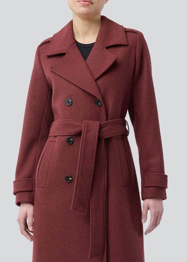 Classic, double-breasted wool coat with collar and notch lapels. ShayMD coat has a wide tiebelt at waist, shoulder straps, wide cuffs and open yoke. With lining and single back vent.