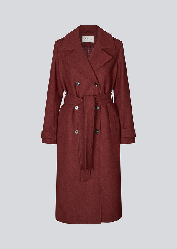 Classic, double-breasted wool coat with collar and notch lapels. ShayMD coat has a wide tiebelt at waist, shoulder straps, wide cuffs and open yoke. With lining and single back vent.