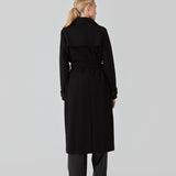 Classic, double-breasted wool coat in black with collar and notch lapels. ShayMD coat has a wide tiebelt at waist, shoulder straps, wide cuffs and open yoke. With lining and single back vent.