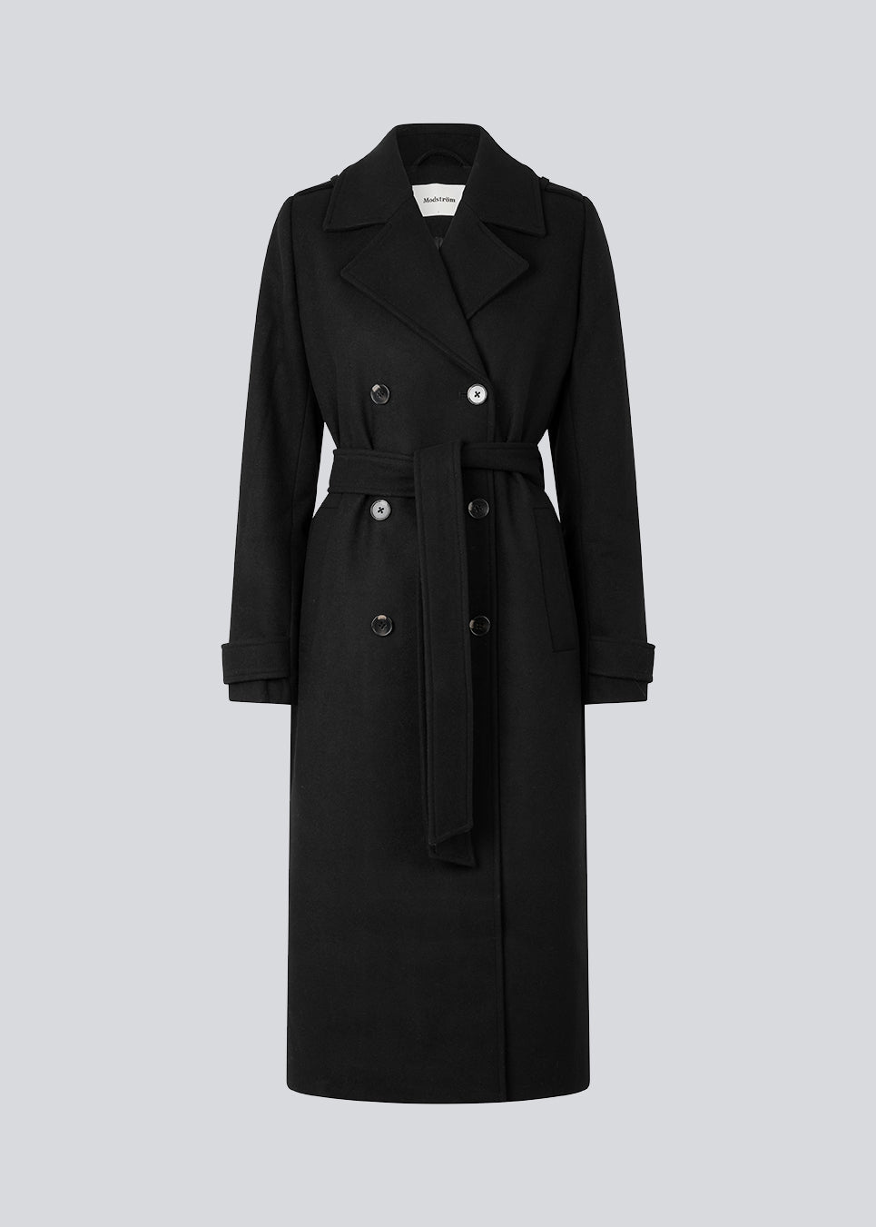 Classic, double-breasted wool coat in black with collar and notch lapels. ShayMD coat has a wide tiebelt at waist, shoulder straps, wide cuffs and open yoke. With lining and single back vent.