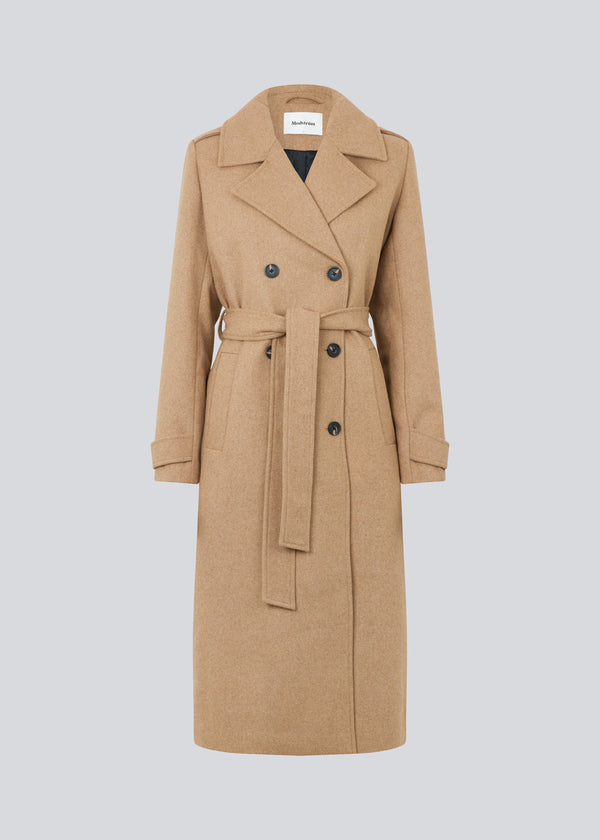 Classic, double-breasted wool coat with collar and notch lapels. ShayMD coat, in the color Brown Sugar, has a wide tiebelt at waist, shoulder straps, wide cuffs and open yoke. With lining and single back vent.