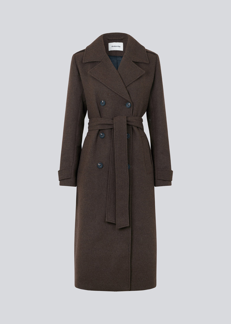Classic, double-breasted wool coat with collar and notch lapels. ShayMD coat, in the color&nbsp;Dark Coffee, has a wide tiebelt at waist, shoulder straps, wide cuffs and open yoke. With lining and single back vent.