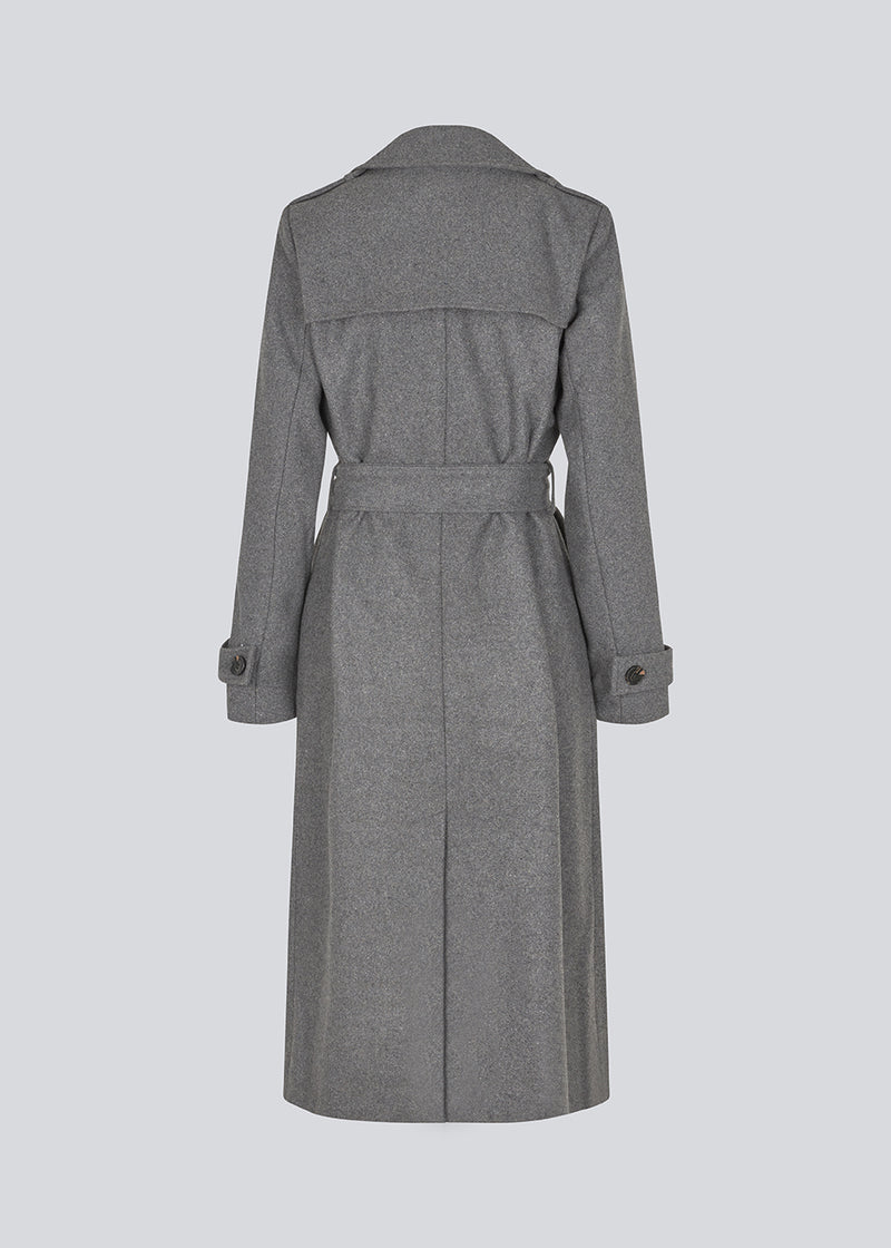 Classic, double-breasted wool coat in grey with collar and notch lapels. ShayMD coat has a wide tiebelt at waist, shoulder straps, wide cuffs and open yoke. With lining and single back vent.