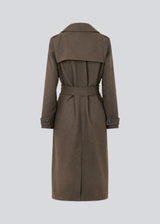 Classic, double-breasted wool coat in a brown color with collar and notch lapels. ShayMD coat has a wide tiebelt at waist, shoulder straps, wide cuffs and open yoke. With lining and single back vent.