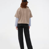 Short-sleeved cape jacket in beige/brown in a soft wool blend. The Siljamd cape has a collar, pockets, and nice brown buttons. Perfect layering over a knit for an elegant, seasonal look.